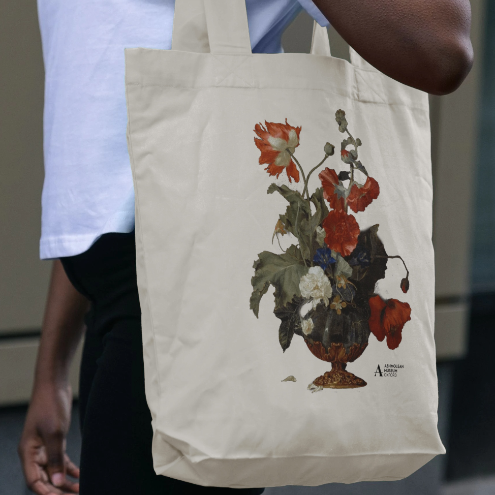 Tote bag with floral design held by a person