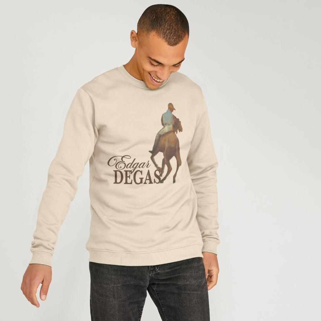 Man wearing a beige sweatshirt with an Edgar Degas artwork on a plain background