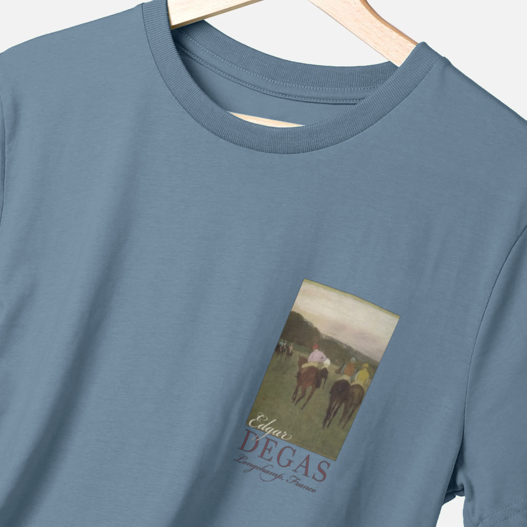 Blue t-shirt with a graphic of horses and 'Edgar Degas' text on a hanger.