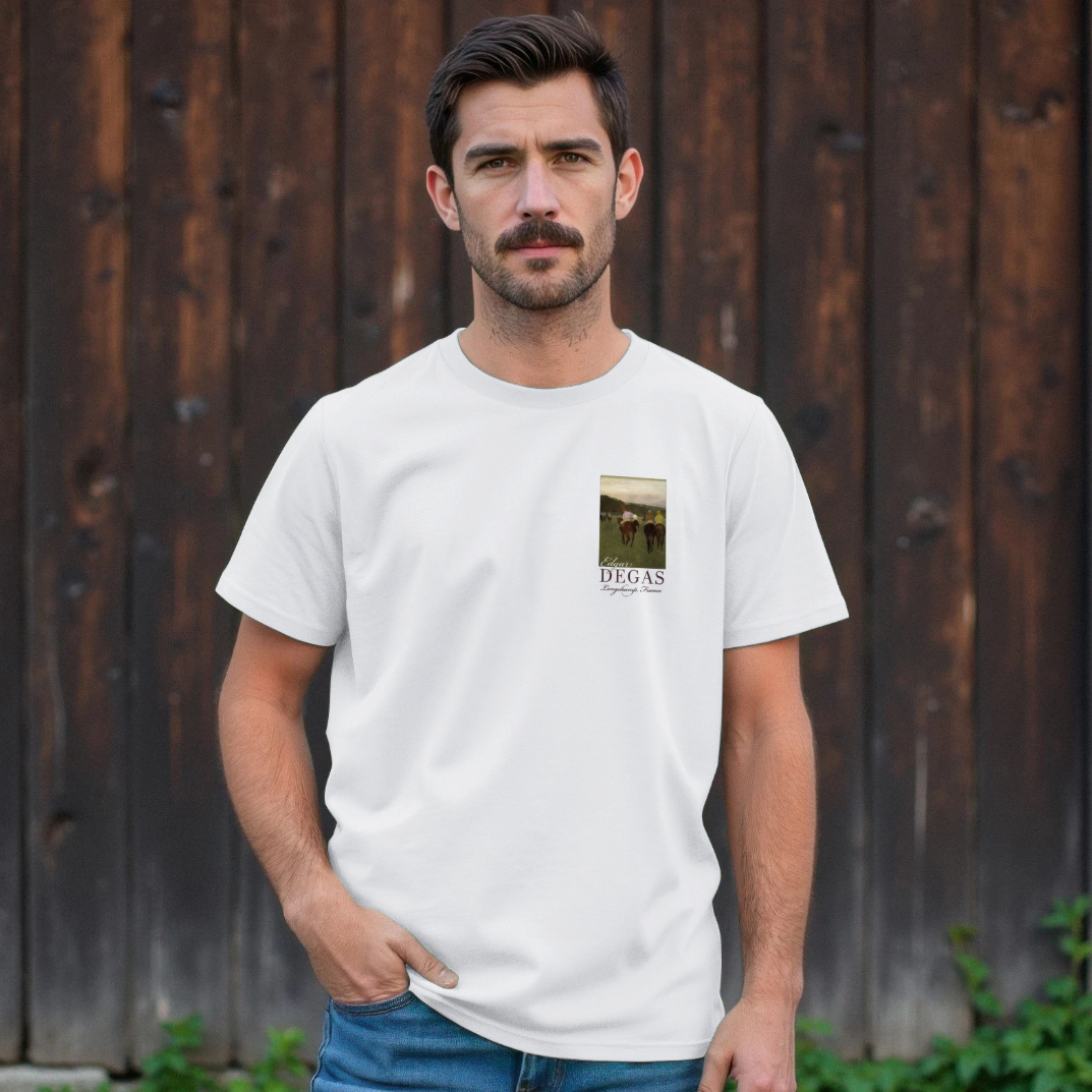 Man wearing a white t-shirt with a small graphic on a wooden background